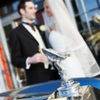 Bride &amp; Groom in front of hotel image